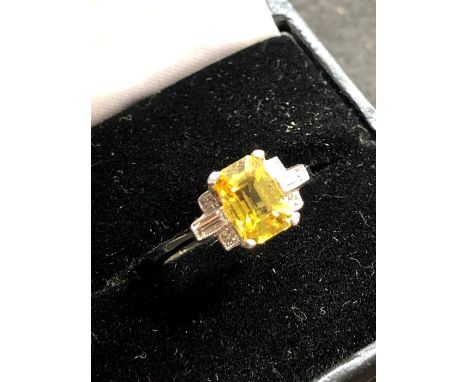 Platinum diamond and yellow sapphire ring hallmarked plat set with large central yellow sapphire that measures approx 8.5mm b