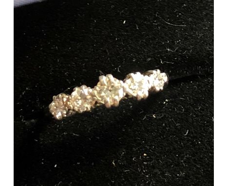 Platinum and diamond ring set with 5 small diamonds 
