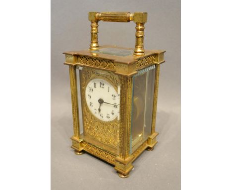 A 19th Century French Brass Cased Carriage Clock, the enamelled dial with Arabic numerals with lever escapement and carrying 