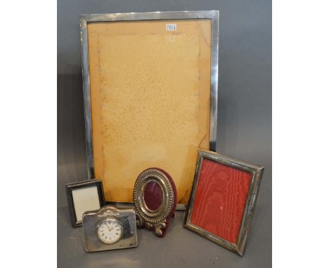 A Birmingham Silver Rectangular Photograph Frame, 30 x 20cm, together with three smaller silver photograph frames and a silve