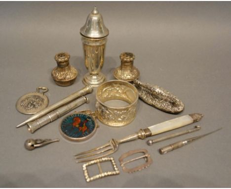 A Small Collection of Silver to include a mother of pearl handled pickle fork, a pair of peppers, a silver napkin ring and ot