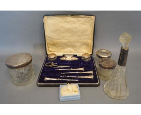 A Silver Part Manicure Set within fitted case, together with four silver mounted dressing table jars and a pair of 9 carat go