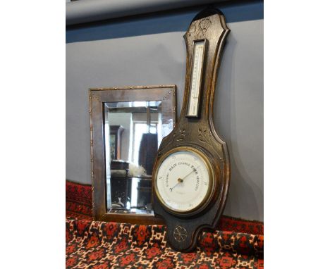 An Arts and Crafts Style Copper Rectangular Wall Mirror together with an oak barometer/thermometer 