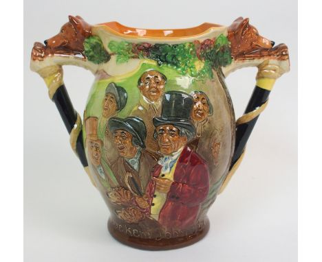 A Royal Doulton 'D'ye Ken John Peel' loving cup depicting John Peel and others, flanked by fox head and walking stick modelle