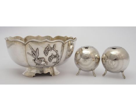 A Chinese silver lobed bowl decorated with a fish, bird and prunus beneath a shaped foliate rim and on tripod foot, signed, W