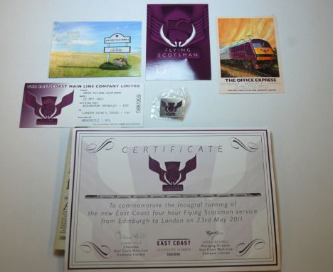 A collection of Flying Scotsman memorabilia including Certificate, lapel badge, post postcards and souvenir ticket No.588 of 