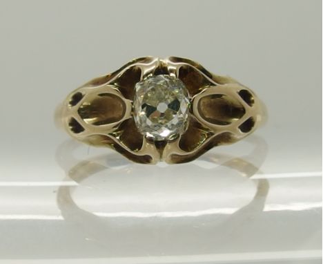 An Art Nouveau old cut diamond ring the diamond of old cut cushion shape is estimated approx 0.60cts, with stylized floral mo