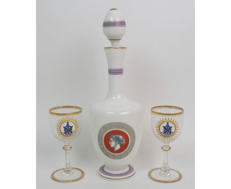 A pair of MacCallum/Malcolm Clan Crest wine glasses each with an enamelled circular plaque painted with a blue tower, above a