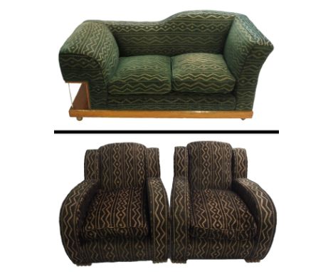 An Art Deco three piece suite comprising; a green upholstered sofa with a walnut frame and side shelf, 78 x 166 x 80cm and tw