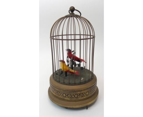 An early 20th century automaton musical box depicting two birds in a bird cage, 27cm high