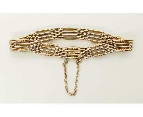 A 15ct gold gate bracelet with beaded bar design, length 18cm, weight 17.1gms