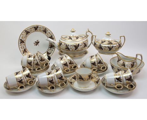 An early 19th Century Chamberlains Worcester porcelain part tea and coffee service painted in brown and gilt with leaf and be