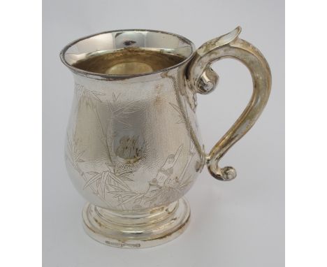 A Chinese silver tankard decorated with bamboo on a textured ground, scroll handle, stamped FJ, Sterling, Hong Kong, 14cm hig