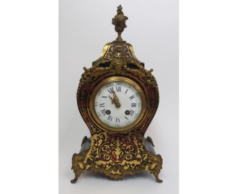 A French tortoiseshell boulle mantle clock the Louis XV-style waisted case with foliate inlay and applied gilt metal mounts, 