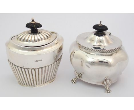 A silver tea caddy rubbed makers marks, Chester 1908, of oval shape with half ribbed body with another silver tea caddy, Ches