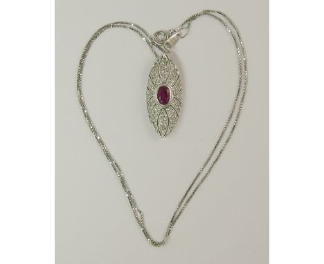 An 18ct white gold ruby and diamond pendant of pave pierced out design with a fine chain, length of the pendant 2.5cm, length