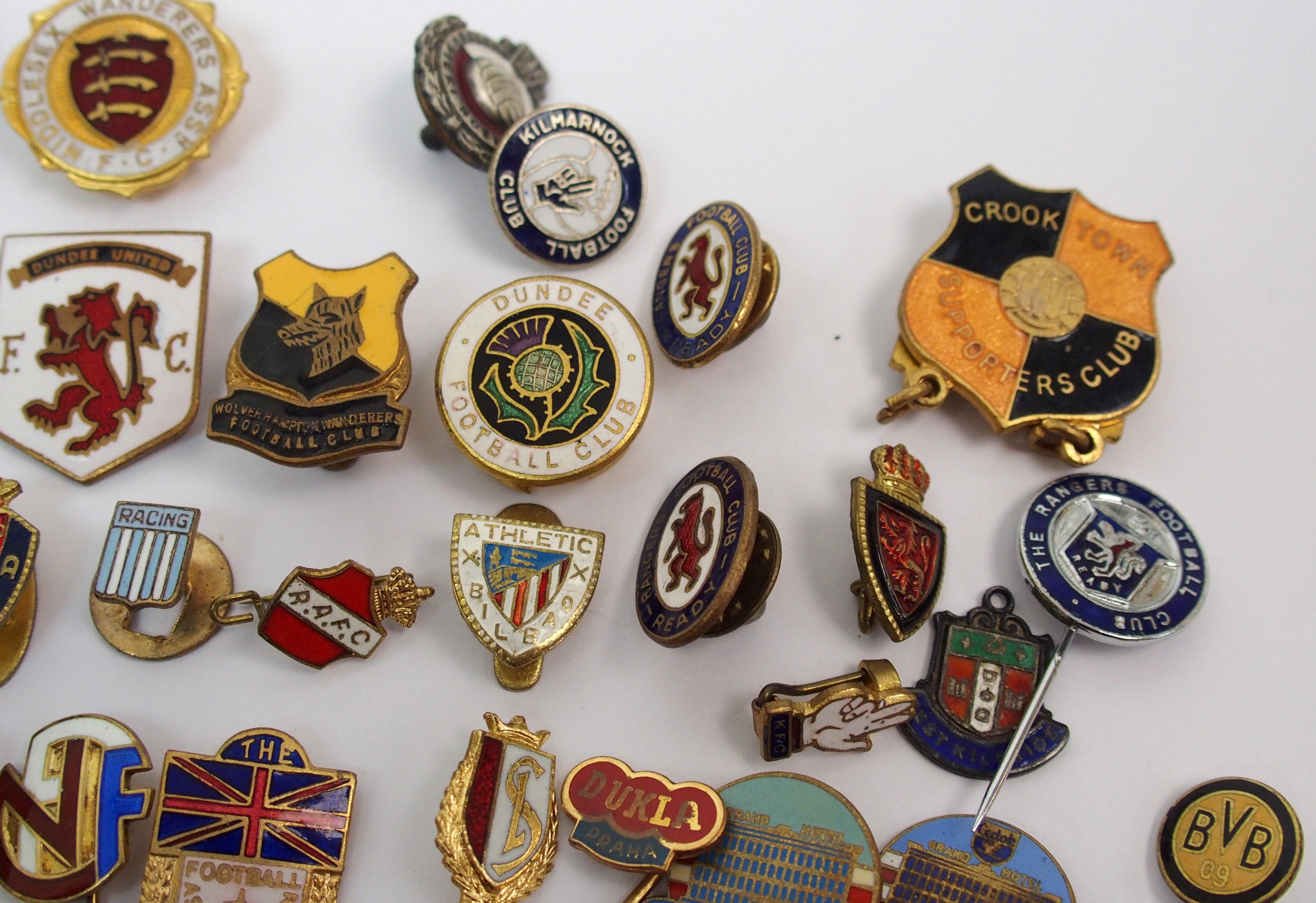 A collection of football enamel lapel badges including English and ...