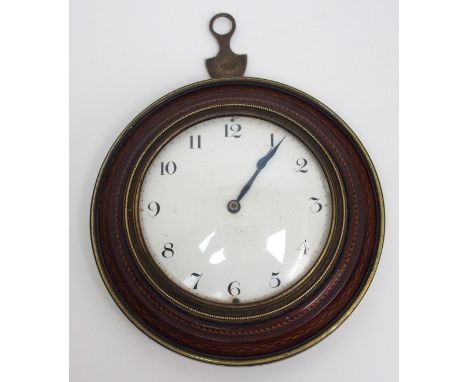 A Regency circular sedan clock the white enamel dial with black numbers in an inlaid wooden mount with brass frame, 15.5cm di