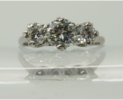 An 18ct and platinum three stone diamond ring of estimated approx 1.40cts, in crown mounts to tapered shank, finger size Q1/2