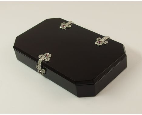 An Art Deco onyx, diamond and ruby box in the manner of CARTIER, both the lid and the box are carved from a continuous slab o