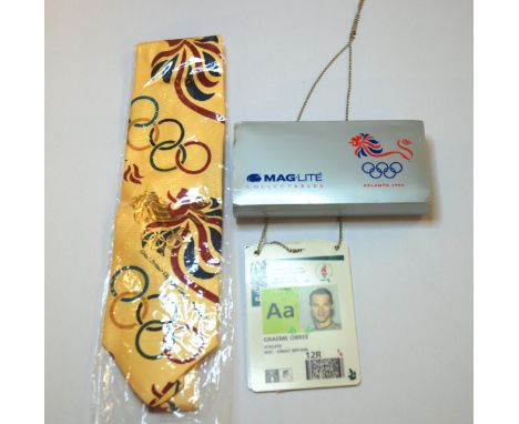 A collection of 1996 Olympic memorabilia relating to Graeme Obree including Swatch watch, shorts, accreditation, tie, Mag-lit