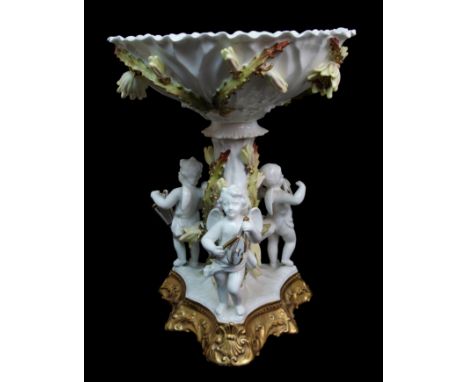 A Victorian pottery centrepiece attributed to Moores the frill edge bowl above a naturalistic tree stem and flanked with thre