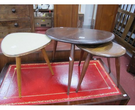 Two Dark Ercol Pebble Tables; together with one other table. (3)