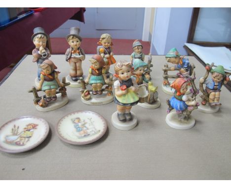 Eleven Hummel Figures; plus two Hummel plaques:- One Tray