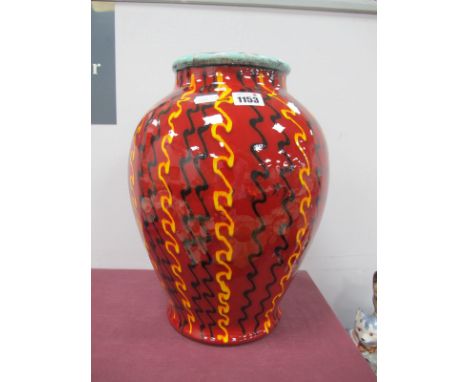 A Poole Pottery Strobe Roman Vase, with black and yellow wavy vertical lines on red ground, with box, 34cm high.