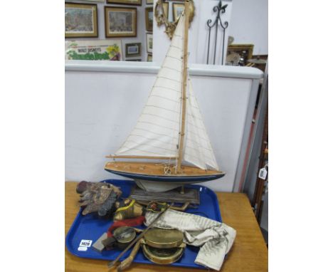 Indonesian Puppet Doll, model yacht mounted on a plinth, Military style compass, brass compass (damaged), lighter:- One Tray.