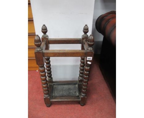 An Early XX Century Oak Stick Stand, with bobbin supports, 36.5cm wide.