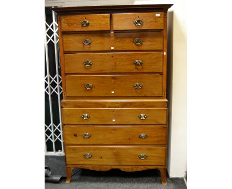 A late 'George III' mahogany chest on chest, ogee cornice above four long drawers, flanked by ebony stung satin wood panels, 