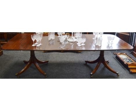 A contemporary mahogany D - end table with additional leaves; outswept fluted tripod legs, terminating in casters; a teak cof
