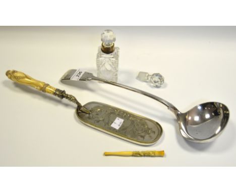 An EPNS Fiddle pattern ladle;  a Victorian ivory hafted crumb scoop;  a silver mounted clear glass scent bottle;  etc 