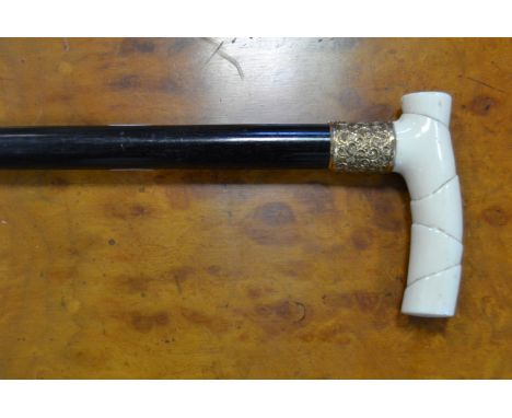 An ivory handled ebony walking stick, early 20th century