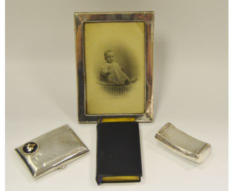 A George III silver snuff box Birmingham 1805; a silver photograph frame Birmingham 1917; a silver cigarette case, Birmingham