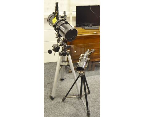 A Celestron 127/EG power seeker Telescope on tripod; another Tasco, with star map (2)