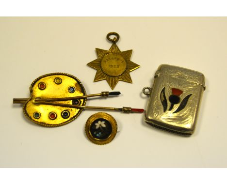 A gold coloured metal, inlaid with Ashford marble brooch; a gilt and enamel brooch in the form of an Artists palette; a silve