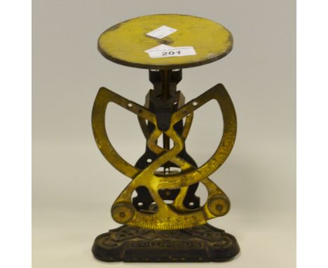 A set of  Apothecary scales complete with a set of five weights; a Columbus Postal scale