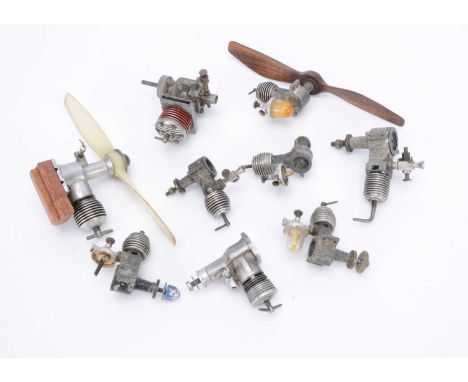 Nine miscellaneous small Diesel Engines, five similar very small engines with 'spherical' cooling fins, one with wooden prop 