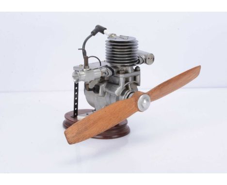 A plinth-mounted Model Petrol Aero-engine, with air-cooled single cylinder approx 25mm dia x 40mm stroke, fitted with 380mm w