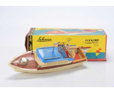 A Schuco Plastic & Tinplate Elektro Nautico 5550 Boat, with plastic hull and detailed tinprinted deck with compass, seated ca