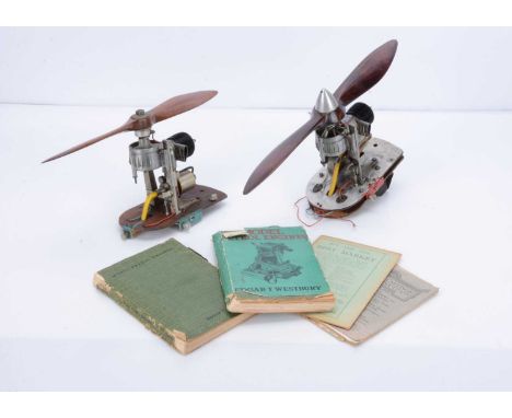 A pair of Bulkhead-mounted Petrol Aero Engines and related books, of similar design, both mounted on wood/aluminium bulkheads