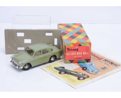SALEROOM ANNOUNCEMENT - Front bumper repaired.A Boxed Tri-ang 1/20 Scale Electric Hillman Minx IIIA Model M018, in green, alt