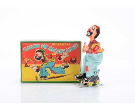 A T.P.S Toplay Ltd (Japan) Tinplate Clockwork Clown On Roller Skate, No.5093, detailed tinprinted Clown figure with checked v