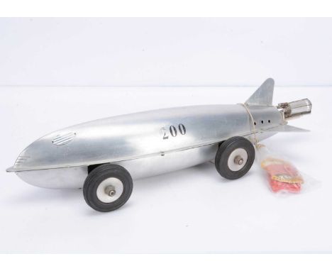 An Uncommon 'Jetex'-powered Car, with lightweight pressed aluminium 'fuselage' in two halves, overall length approx 600mm, wi