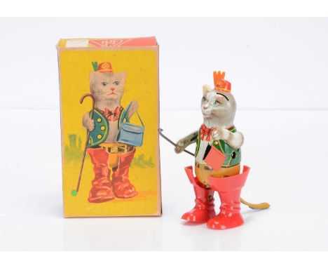 A Köhler (West Germany) Tinplate Clockwork Puss In Boots, with detailed tinprinted body, walking stick, purse and red plastic