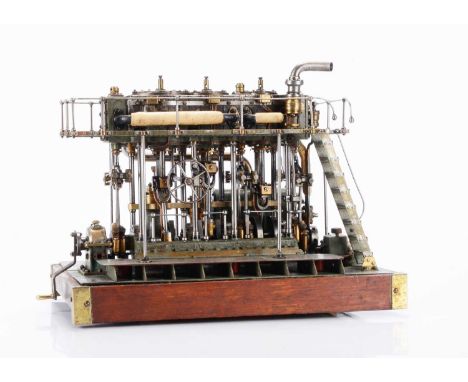 A finely-made model triple-expansion Marine Compound Engine, with hand-crank mounted on output end of crankshaft to demonstra