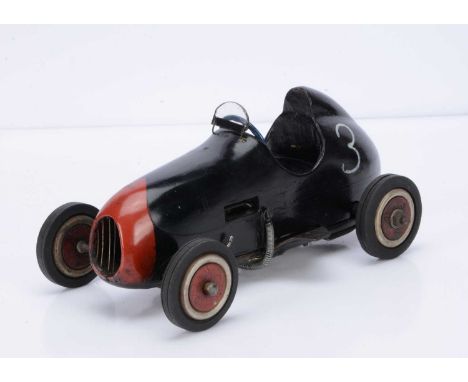 A small Diesel-Engined Tether Racing Car, measuring approx 290mm overall, with wooden base and carved wooden body, appears to