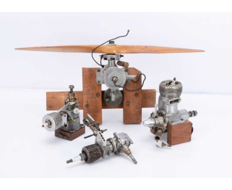 Four larger Model Petrol Aero-Engines (4), one by Forster Bros mounted on wooden blocks, with 18" wooden prop, Champion spark